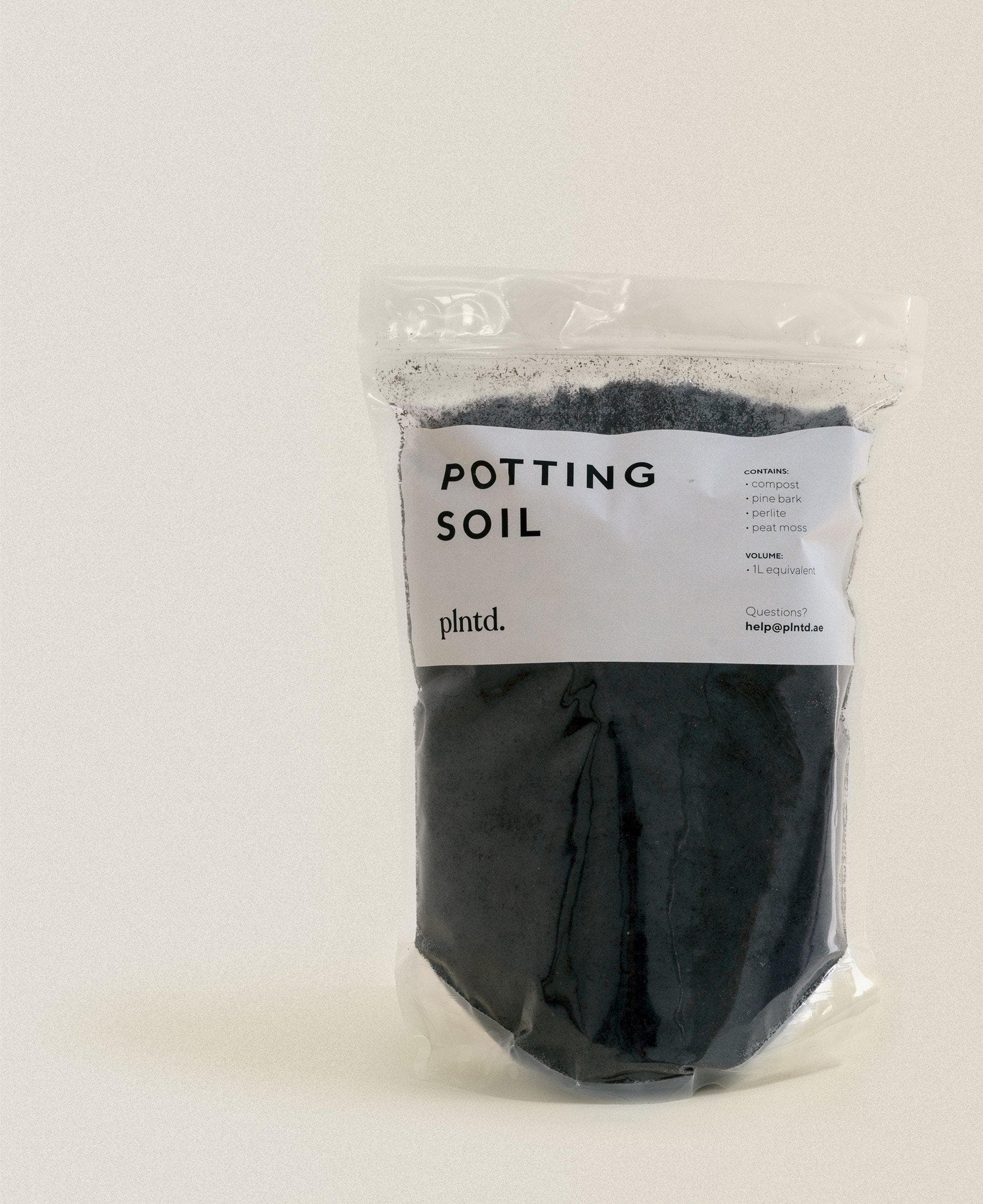 Clear bag of potting soil for indoor plants