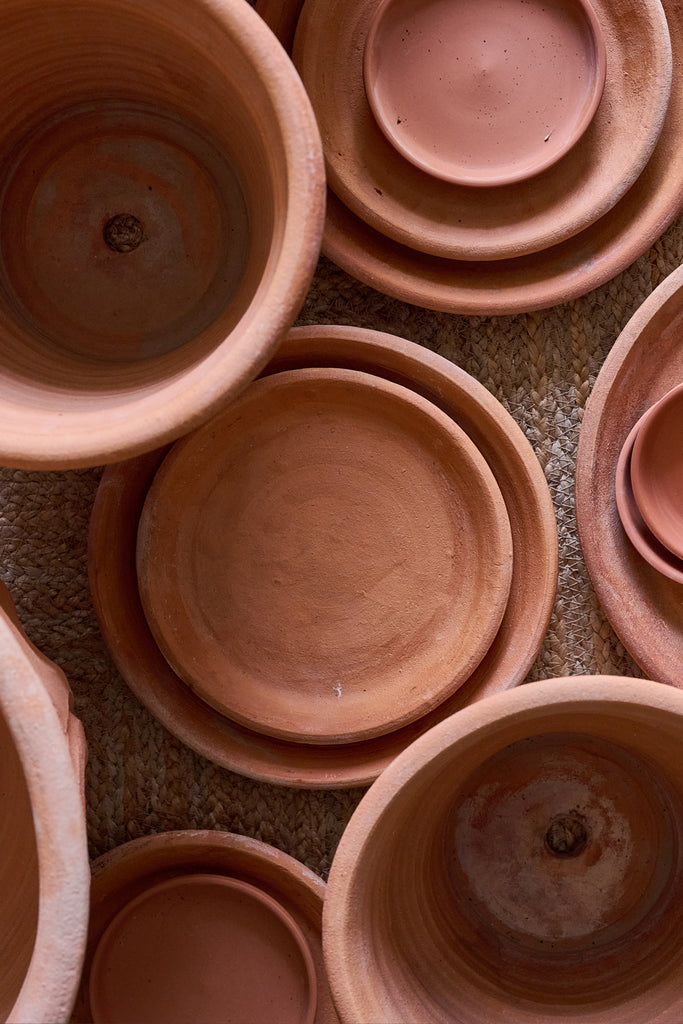 Terracotta planters and saucers